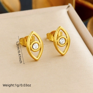 Detail view of gold evil eye stud earrings with sizing info and clear gemstone