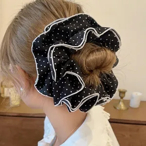 Elegant black and white polka dot scrunchie with layered pleated edges for women