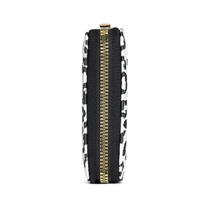 Leopard print card holder wallet with premium gold zipper shown from a side profile view