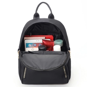 Women's black nylon backpack with a spacious main compartment and side zipper pockets