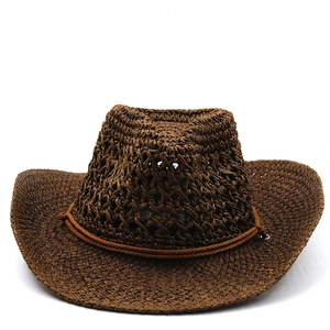Detailed close-up of brown woven cowboy hat with hollow breathable design and side ties