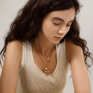 Three-layer gold stainless steel necklace with starfish, shell, and pearl pendants