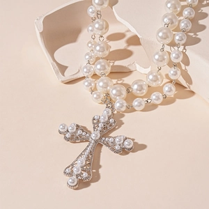 Double-layered pearl necklace featuring a large silver hollow cross pendant for women
