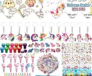 Flat lay of 154-piece unicorn party favors set including rings, stickers, and bracelets
