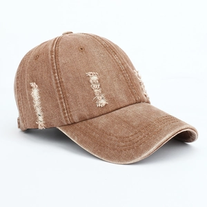 Close-up of brown distressed baseball cap with vintage washed texture and worn details