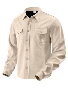 Detailed close-up of corduroy fabric texture and breast pockets on beige shirt