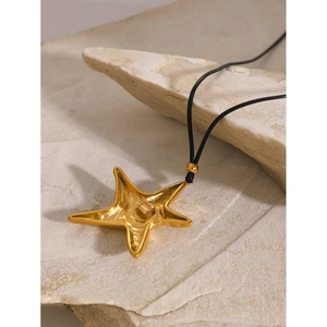 18k gold plated starfish pendant necklace with black cord on stone, vintage style jewelry