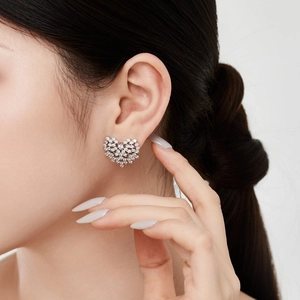 Exquisite S925 sterling silver heart-shaped stud earrings featuring pave-set cubic zirconia