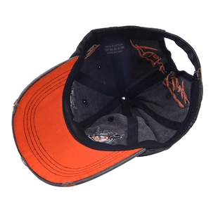 Detail view of washed cotton baseball cap showing interior stitching and 100% cotton label