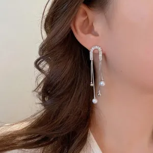 Silver bow pearl tassel drop earrings with sparkling rhinestones for a minimalist luxury look