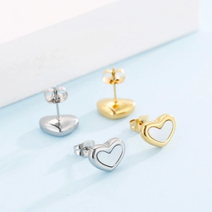 Minimalist heart-shaped stud earrings in gold and silver with white shell inlay