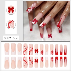 Faux ongles Noël dégradé rouge avec flocons et nœuds 3D en forme de cercueil long