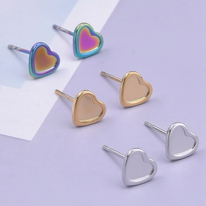 Detailed view of heart-shaped 304 stainless steel stud earrings in silver gold and rainbow