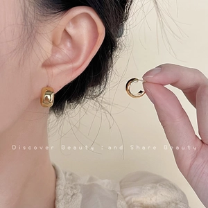 Polished 18K gold-plated C-shape thick hoop earrings with minimalist modern design for women
