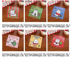 Close-up of 6 cute cartoon dog Christmas packaging cards on a wooden surface