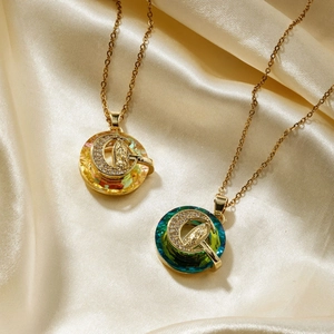 Religious pendant necklace with amber and turquoise crystals and crescent moon detail