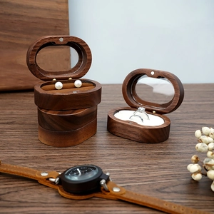 Detail of premium walnut wood jewelry boxes with slots for rings and earrings