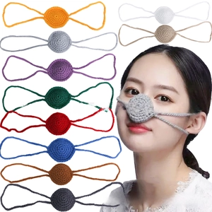 Detail of multi-color crochet nose warmers showing knitted texture and elastic ear loops