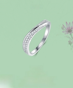Close-up of S925 sterling silver ring with twisted wave band and pavé cubic zirconia