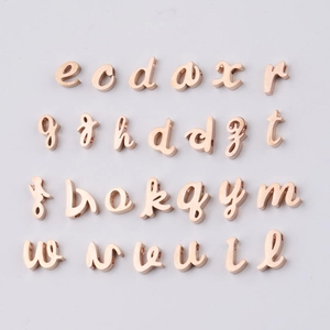 Detailed grid of rose gold mirror-finish stainless steel lowercase letter beads for DIY jewelry