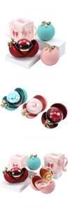 Detail view of spherical flower jewelry box with magnetic bow and premium gift packaging