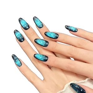 Blue and black gradient starry sky press-on nails with white speckles in long oval shape