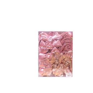 Pink and gold Christmas tree decoration set with bows, flowers, and shiny baubles