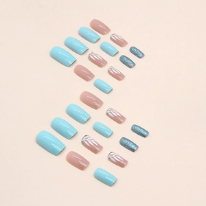 Square press-on nails with blue and pink tones featuring white leaf patterns and glitter