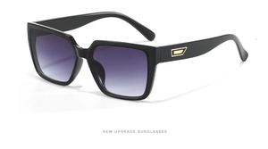 Detail of square black sunglasses with purple gradient lenses and metallic temple accents
