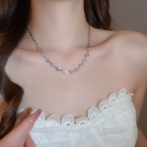 Detail of pink and white zircon square pendant necklace on model's neck for elegant look