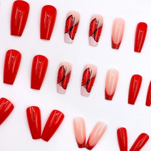 Elegant long coffin press-on nails with red French tips, glitter and butterfly design