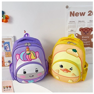 Detail of hardshell backpacks featuring purple unicorn and yellow duck designs for children