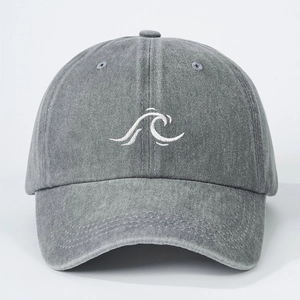 Detail of grey washed cotton baseball cap featuring white wave embroidery on the front
