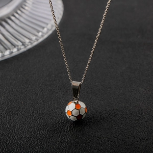 Close-up of a titanium steel football pendant with colorful enamel on a silver chain