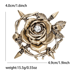 Retro bronze skull and rose brooch with rhinestones and thorn branch details