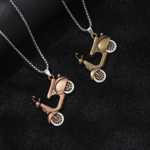 Vintage motorcycle pendant necklace in antique bronze and gold with silver metal chains