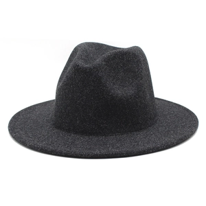 Detail of dark gray wool felt fedora with textured finish and classic creased crown