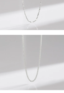 Detailed view of silver heart snake chain necklace with dense twisted rope texture