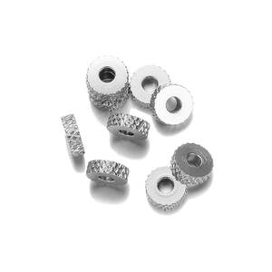 Close-up of 6mm silver knurled stainless steel spacer beads for DIY jewelry making