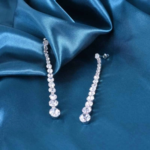 Elegant 925 silver needle drop earrings with sparkling zircon tassels on blue silk