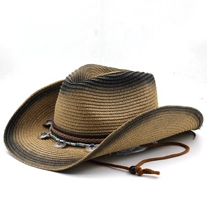 Close-up of woven straw cowboy hat featuring blue gemstone buckle and chin strap