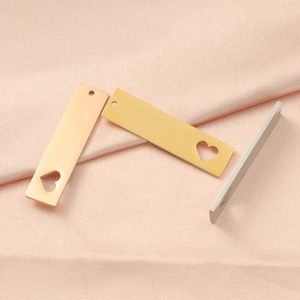 Polished rectangular stainless steel heart cutout pendants in rose gold, gold and silver