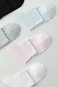 Detailed flat lay of breathable thin ankle socks in diverse pastel and basic colors