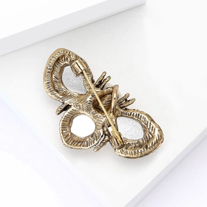 Detailed back view of vintage gold bee brooch showing the secure pin fastener and metal texture