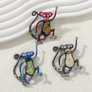 Three colorful alloy monkey brooches with floral patterns in red, blue and grey black