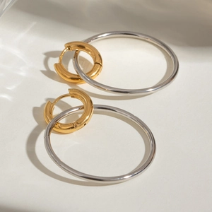 Polished stainless steel two-tone hoop earrings with gold and silver interlaced rings