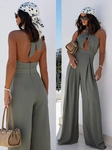 Sage green halter neck jumpsuit with backless tie detail and wide-leg trousers