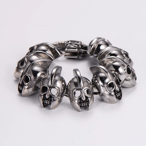 Retro punk stainless steel skull helmet bracelet in vintage silver finish on white background