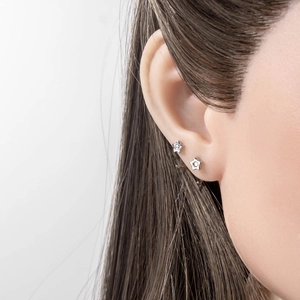 Minimalist silver star earrings on model, sleek C-shape design for daily wear