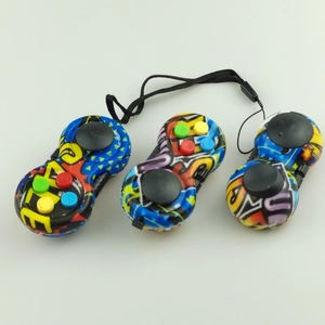 Three stress relief cube controllers with colorful graffiti patterns and silicone buttons